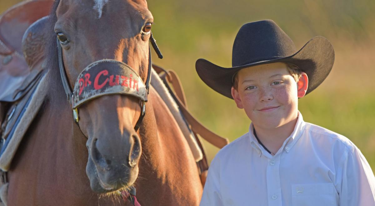 Aden Bernhagen poses with his quarterhorse Dr. Cuzin. (photo courtesy of the Corsicana Daily Sun)