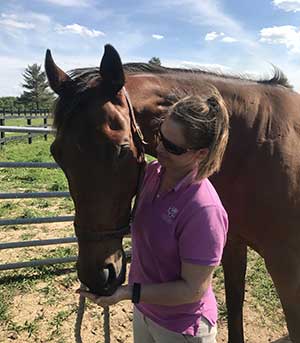 Dr. Metcalfe with her off the track Thoroughbred