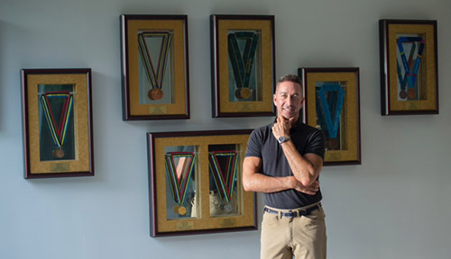 Robert in front of his medals: By Isabel J. Kurek