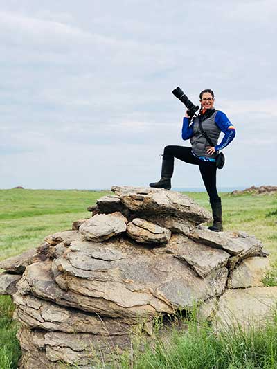 Media Consultant Heather Wallace looks for the best vantage point to photograph the riders. © Gobi Desert Cup