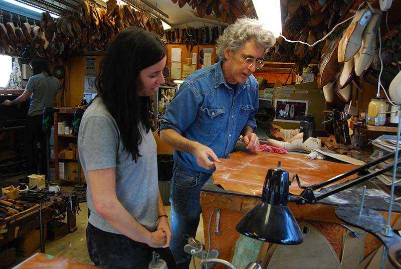 Lee working with Charlotte as they plan foot portions for a pair of boots